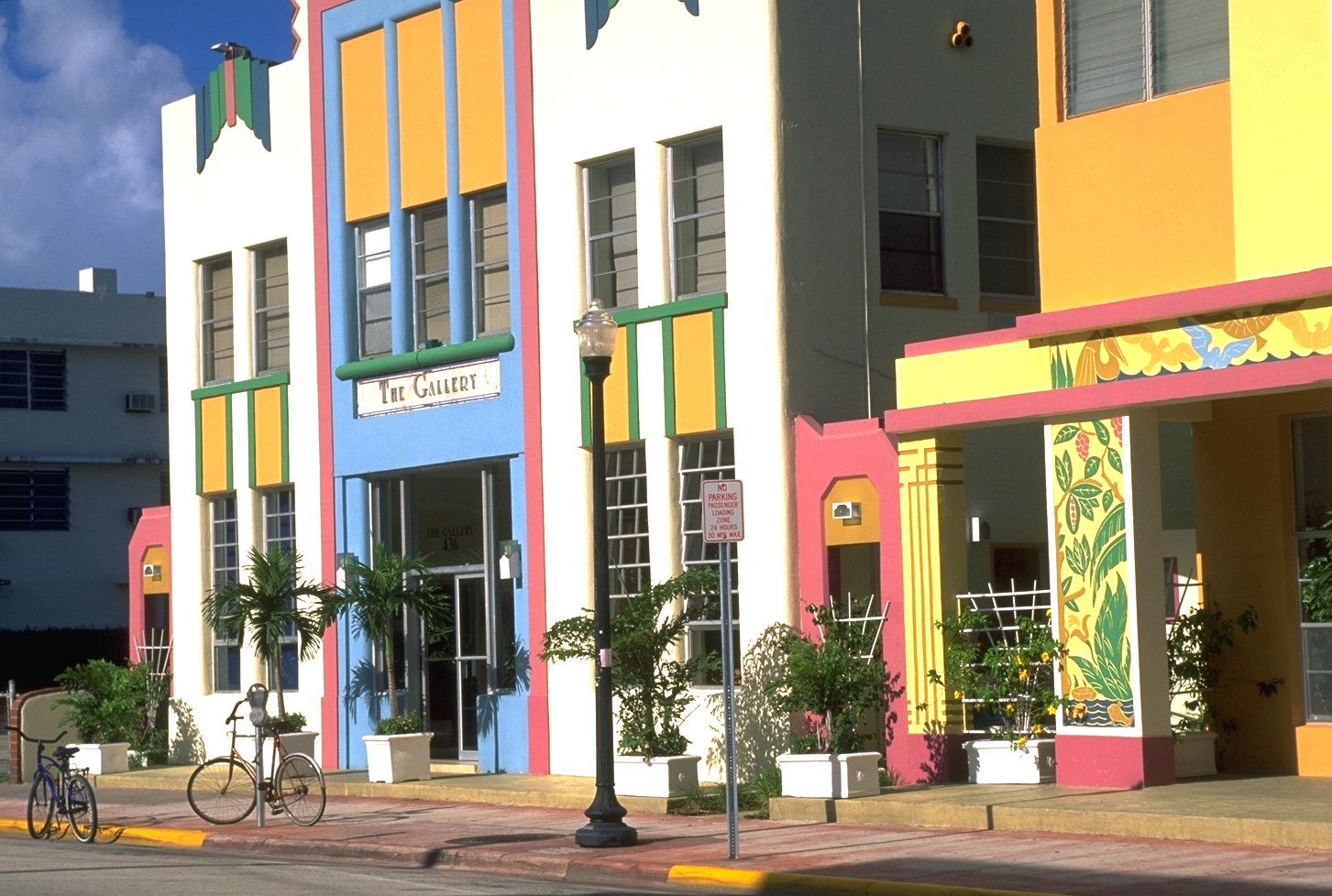 A series of buildings and shops with colorful exterior