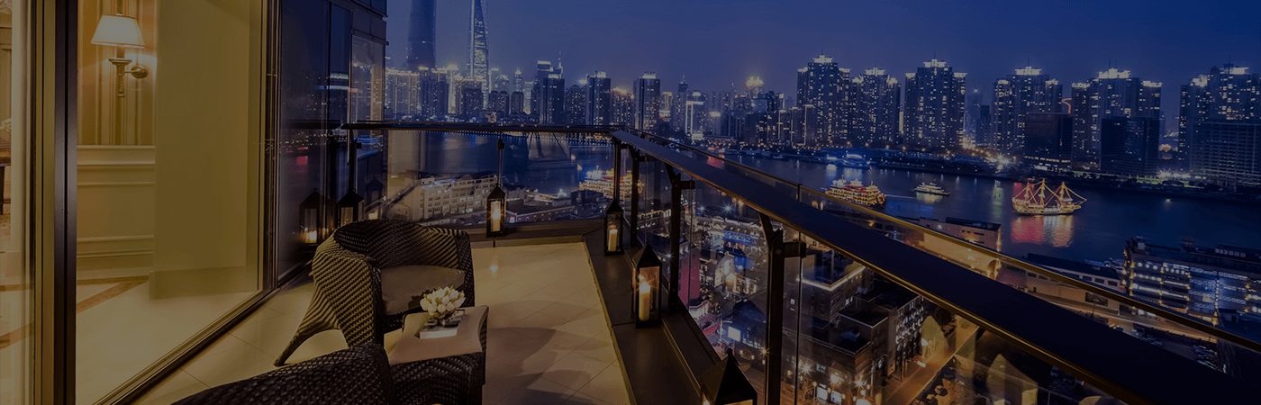 Night view of a city with a balcony