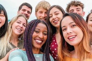 Group of people standing together and smiling